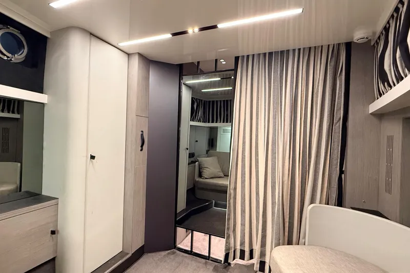  Yacht Photos Pics Interior of 2022 Cranchi A46 Luxury Tender with modern design and striped curtains.