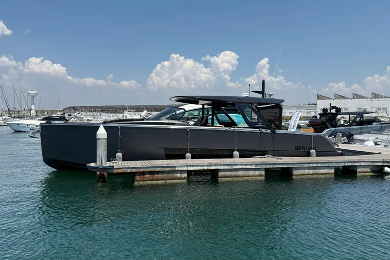  Yacht Photos Pics 2022 Cranchi A46 Luxury Tender docked at marina under clear blue sky.