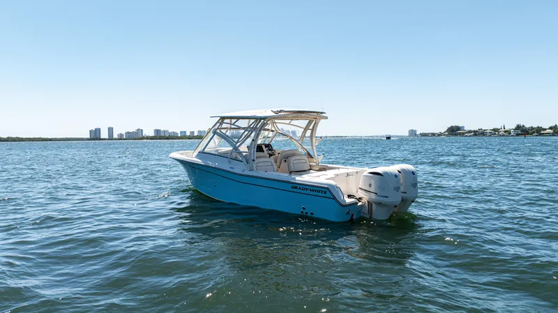  Yacht Photos Pics 2020 Grady-White Freedom 285 boat on open water, clear sky background.