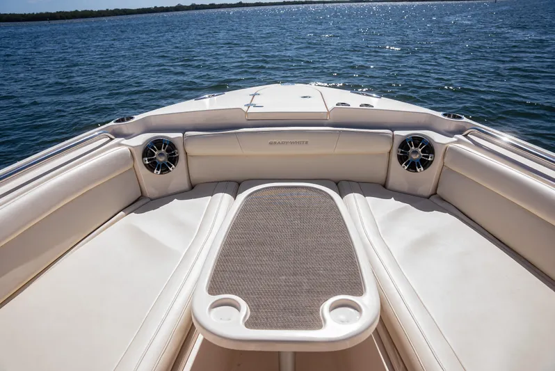 Yacht Photos Pics 2020 Grady-White Freedom 285 boat interior with seating and table on open water.
