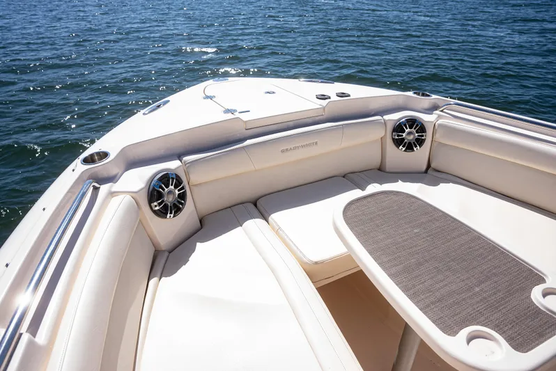  Yacht Photos Pics 2020 Grady-White Freedom 285 boat interior with seating and table on water.