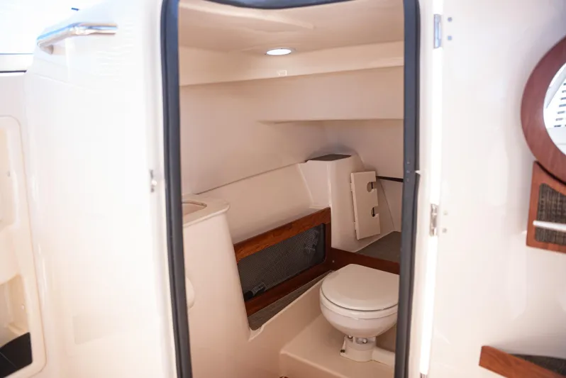  Yacht Photos Pics 2020 Grady-White Freedom 285 boat interior with compact bathroom amenities.