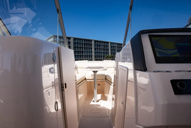 Yacht Photos Pics 2020 Grady-White Freedom 285 boat interior with modern dashboard and seating.