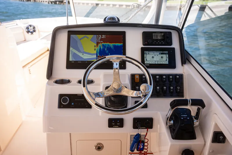  Yacht Photos Pics 2020 Grady-White Freedom 285 boat dashboard with navigation and control systems.