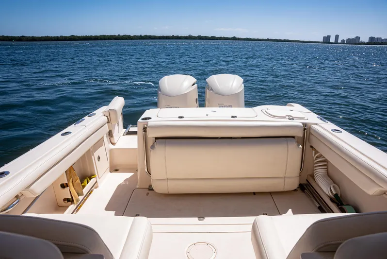  Yacht Photos Pics 2020 Grady-White Freedom 285 boat interior with twin engines on open water.
