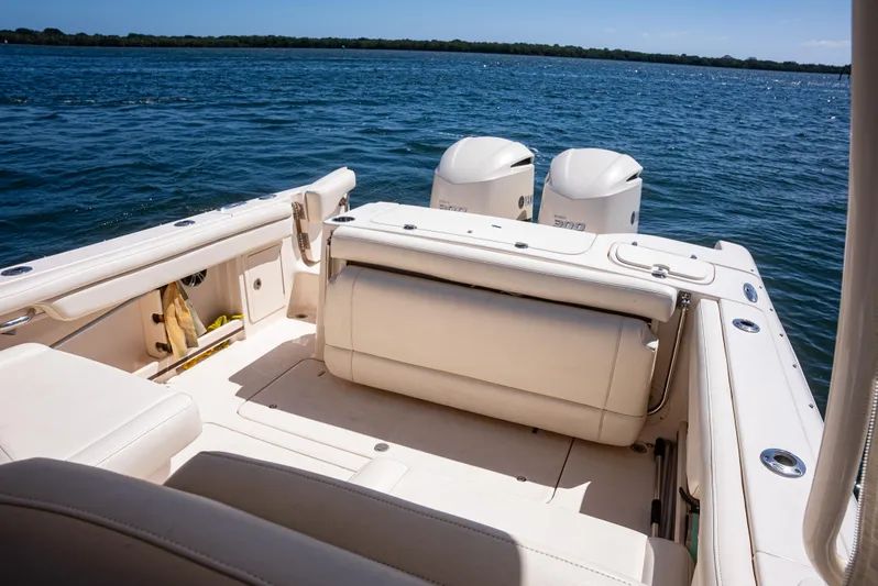  Yacht Photos Pics 2020 Grady-White Freedom 285 boat interior with twin engines on a sunny day.