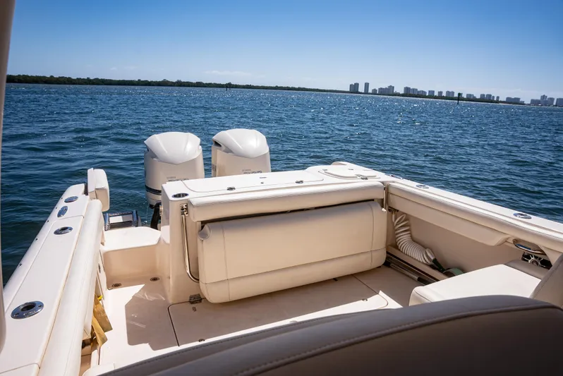  Yacht Photos Pics 2020 Grady-White Freedom 285 boat on open water, featuring dual engines and spacious seating.