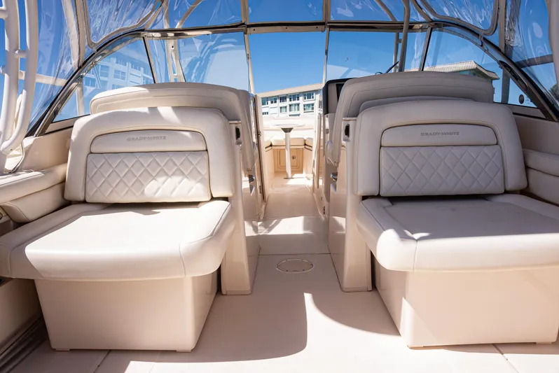 Yacht Photos Pics 2020 Grady-White Freedom 285 boat interior with luxurious seating and clear canopy.
