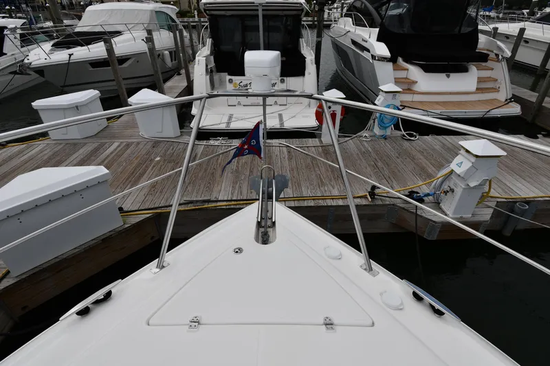 Core Values Yacht Photos Pics 2007 Cruisers Yachts 455 Express Motoryacht docked at marina, viewed from bow.