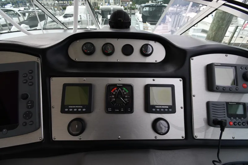 Core Values Yacht Photos Pics Dashboard of 2007 Cruisers Yachts 455 Express Motoryacht with navigation instruments and controls.