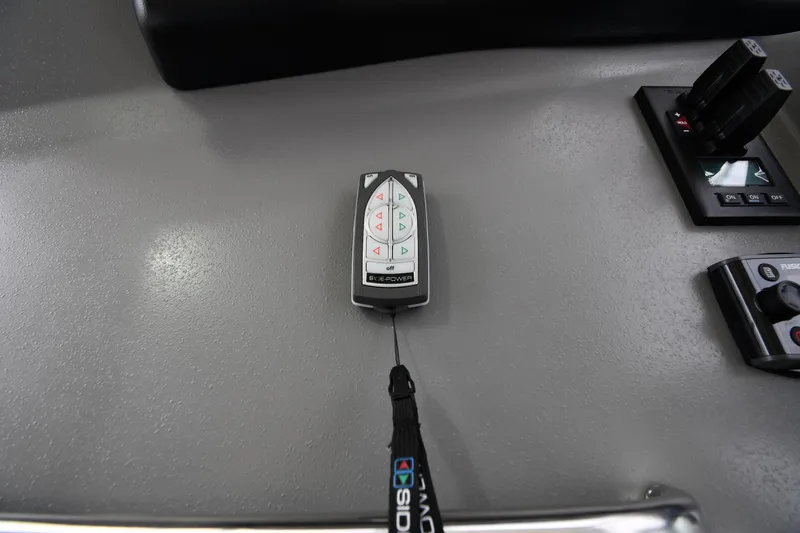 Core Values Yacht Photos Pics Control panel of 2007 Cruisers Yachts 455 Express Motoryacht with remote and switches.