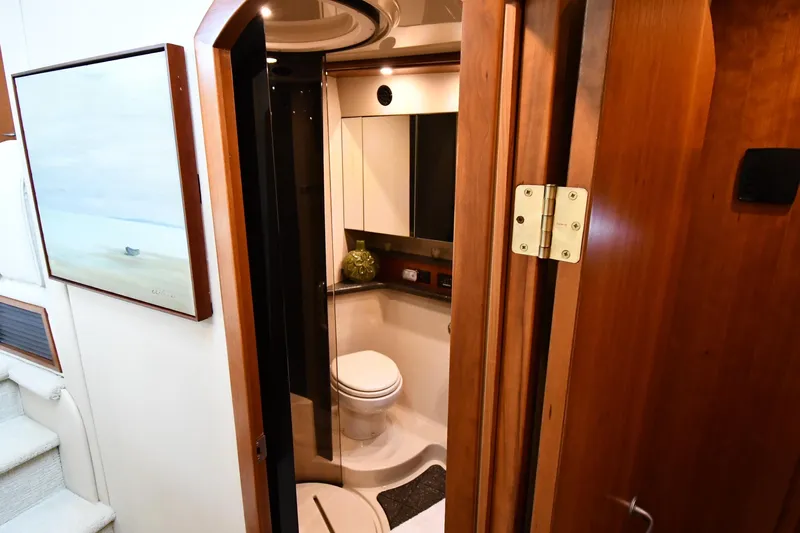 Core Values Yacht Photos Pics Luxurious bathroom interior of 2007 Cruisers Yachts 455 Express Motoryacht, featuring modern amenities.