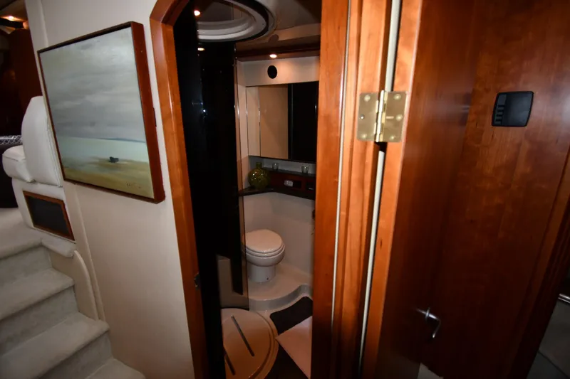Core Values Yacht Photos Pics Luxurious bathroom interior of 2007 Cruisers Yachts 455 Express Motoryacht with wood accents.