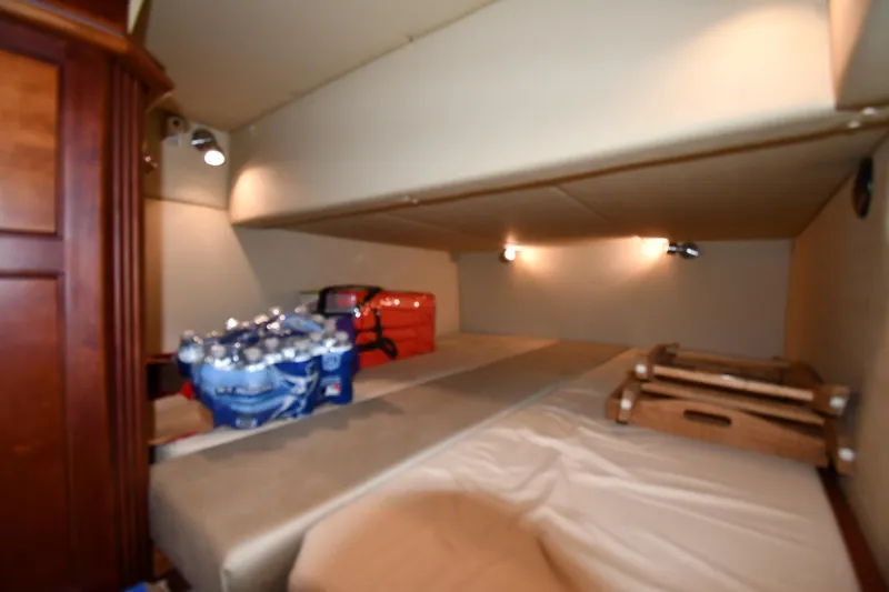 Core Values Yacht Photos Pics 2007 Cruisers Yachts 455 Express Motoryacht interior storage area with supplies.
