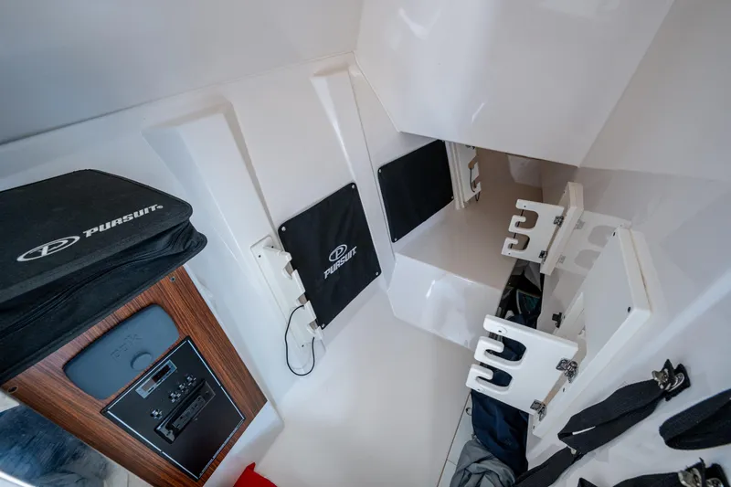  Yacht Photos Pics 2017 Pursuit DC 295 Dual Console interior with storage compartments and control panel.