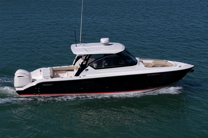  Yacht Photos Pics 2017 Pursuit DC 295 Dual Console boat cruising on open water.