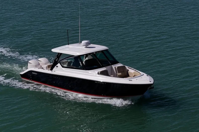  Yacht Photos Pics 2017 Pursuit DC 295 Dual Console boat cruising on open water.
