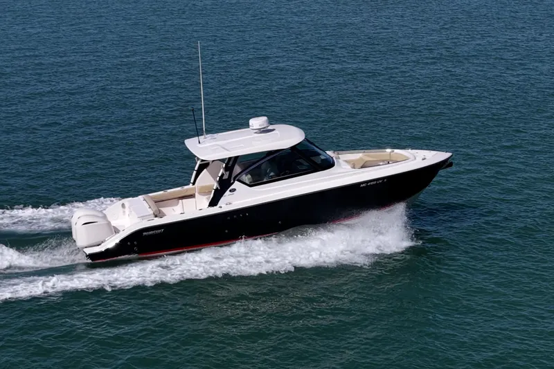  Yacht Photos Pics 2017 Pursuit DC 295 Dual Console boat cruising on open water.