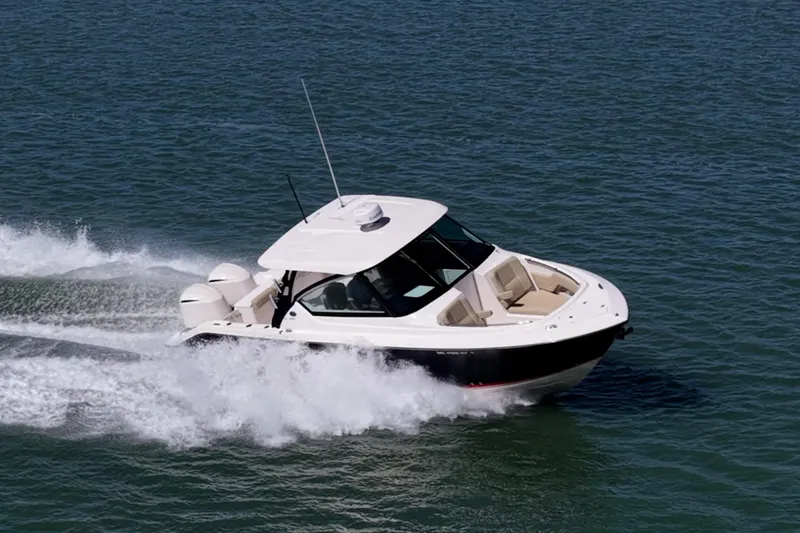  Yacht Photos Pics 2017 Pursuit DC 295 Dual Console boat cruising on open water.