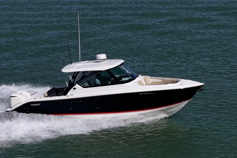  Yacht Photos Pics 2017 Pursuit DC 295 Dual Console boat cruising on open water.