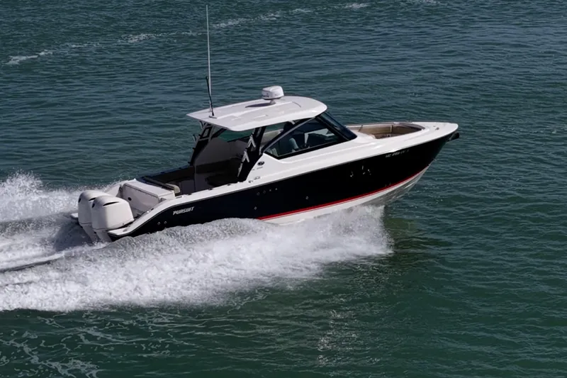  Yacht Photos Pics 2017 Pursuit DC 295 Dual Console boat cruising on open water.