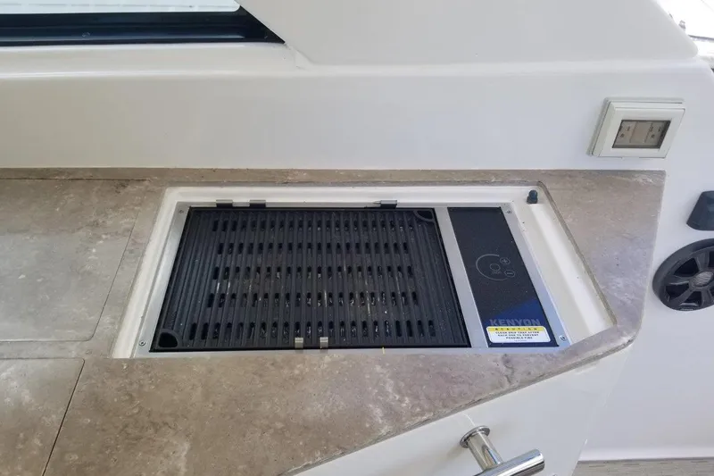 Ships N Giggles Yacht Photos Pics Built-in grill on 2018 Regal 35 Sport Coupe yacht's countertop.