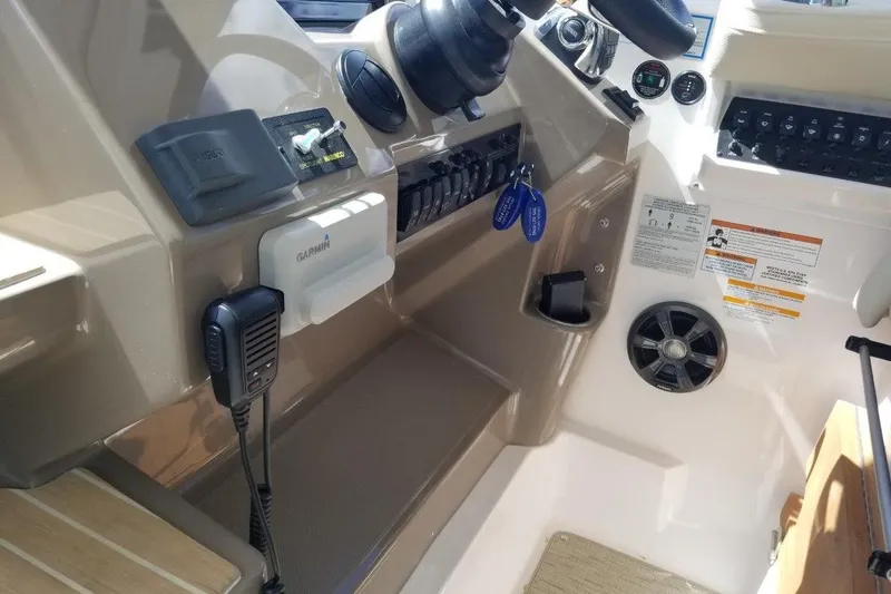 Ships N Giggles Yacht Photos Pics 2018 Regal 35 Sport Coupe dashboard with Garmin device and control panel.