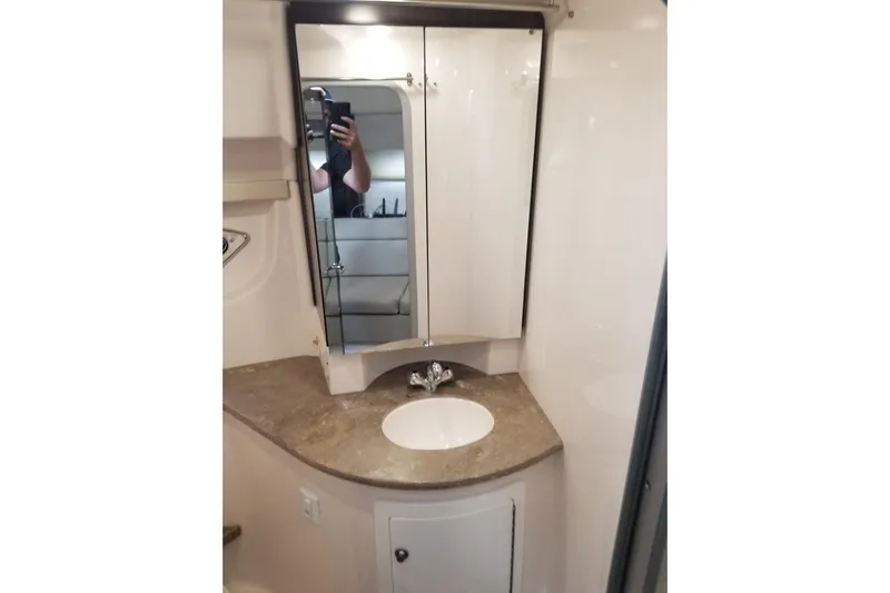 Ships N Giggles Yacht Photos Pics Bathroom vanity in 2018 Regal 35 Sport Coupe with mirrored cabinet and sink.