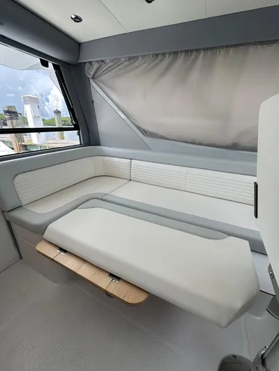  Yacht Photos Pics Luxurious interior of 2025 ArrowCat 320 boat with modern seating and sleek design.