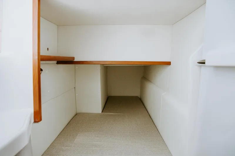  Yacht Photos Pics 2025 ArrowCat 320 interior cabin with wooden accents and white walls.