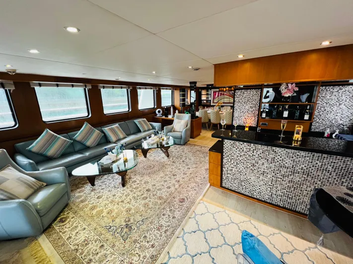  Yacht Photos Pics Luxurious 2012 Superyacht 128 interior with elegant seating, bar, and panoramic windows.