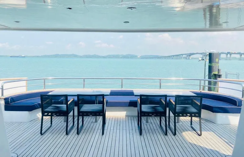  Yacht Photos Pics Luxurious deck view on 2012 Superyacht 128, featuring ocean and seating area.