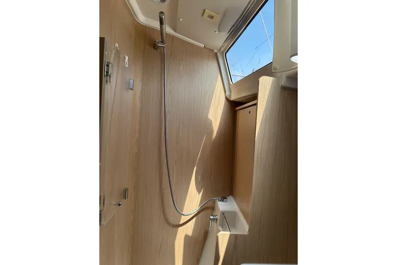  Yacht Photos Pics Interior shower of 2020 Beneteau Oceanis 41.1 yacht with wooden finish.