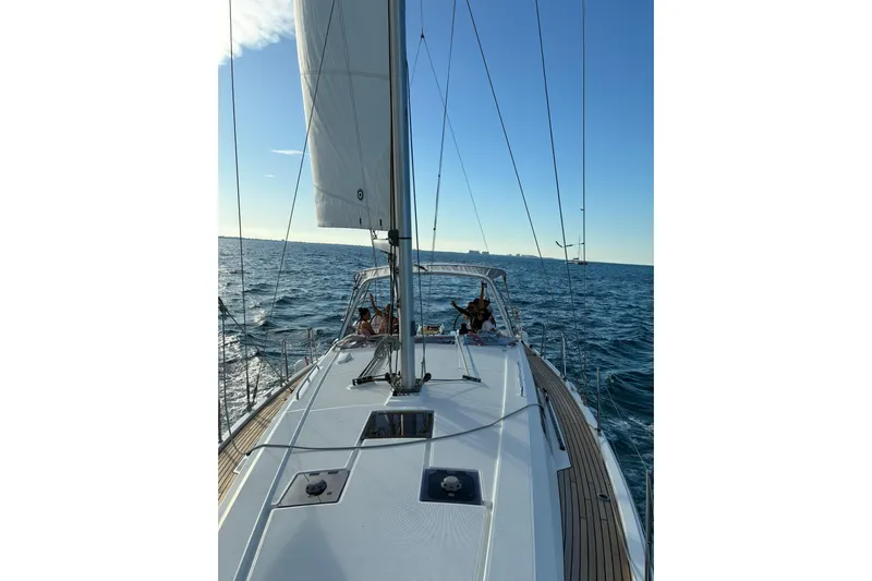  Yacht Photos Pics 2020 Beneteau Oceanis 41.1 sailing on open sea under clear blue sky.
