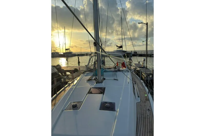  Yacht Photos Pics 2020 Beneteau Oceanis 41.1 sailboat docked at sunset, with scenic harbor view.