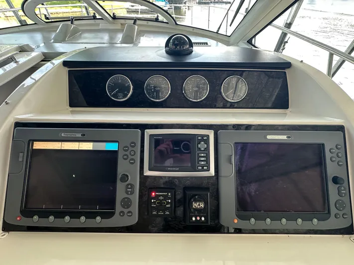  Yacht Photos Pics Control panel of 2010 Sea Ray 450 Sundancer yacht with navigation instruments.