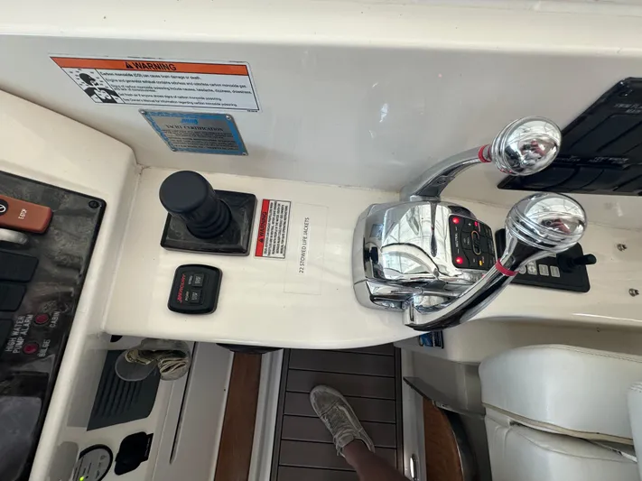  Yacht Photos Pics Control panel of a 2010 Sea Ray 450 Sundancer yacht with throttle and joystick.