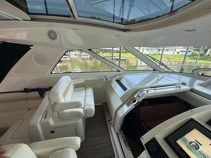  Yacht Photos Pics Interior of 2010 Sea Ray 450 Sundancer yacht with luxurious seating and helm.