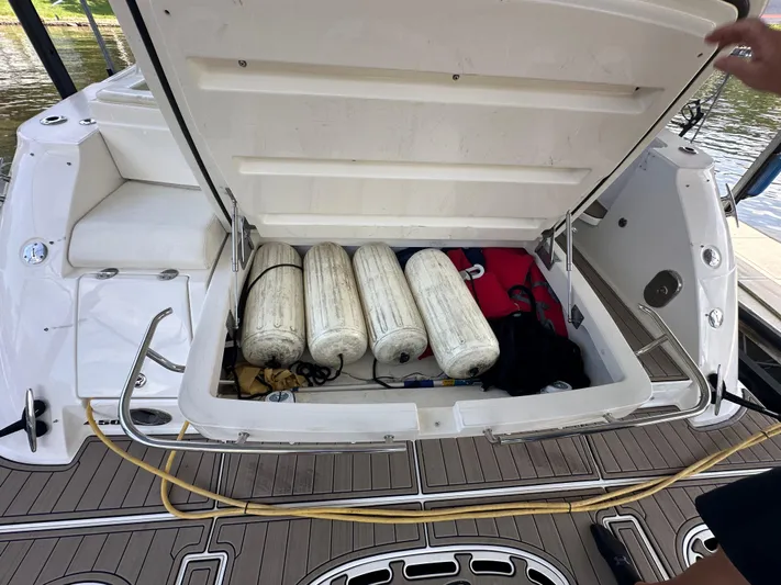  Yacht Photos Pics Open storage compartment on 2010 Sea Ray 450 Sundancer boat with fenders and equipment.