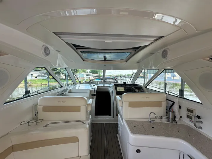  Yacht Photos Pics Interior of 2010 Sea Ray 450 Sundancer yacht with luxurious seating and helm.