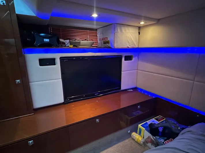  Yacht Photos Pics Interior of 2010 Sea Ray 450 Sundancer with TV, blue LED lighting, and storage space.