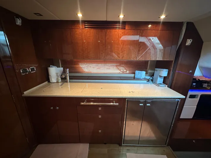  Yacht Photos Pics Luxurious kitchen interior of 2010 Sea Ray 450 Sundancer yacht with modern amenities.