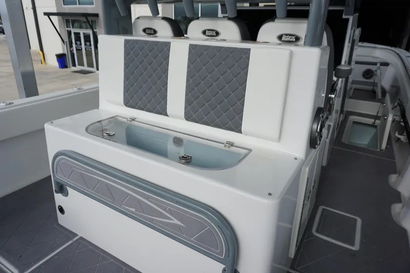 Obsession II Yacht Photos Pics 2023 Insetta 35IFC boat interior with cushioned seating and storage compartments.