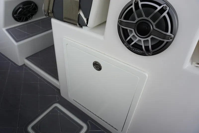 Obsession II Yacht Photos Pics 2023 Insetta 35IFC boat interior with speaker and storage compartment.