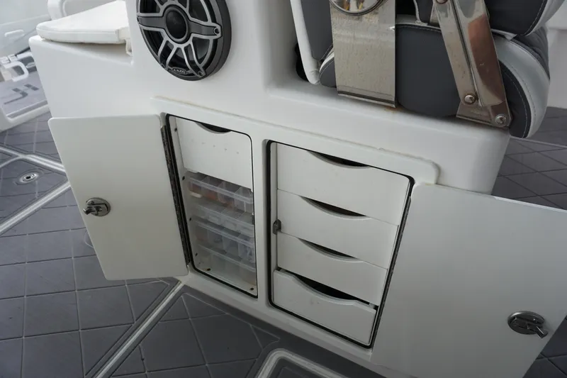 Obsession II Yacht Photos Pics 2023 Insetta 35IFC boat storage compartments with open doors and speaker.