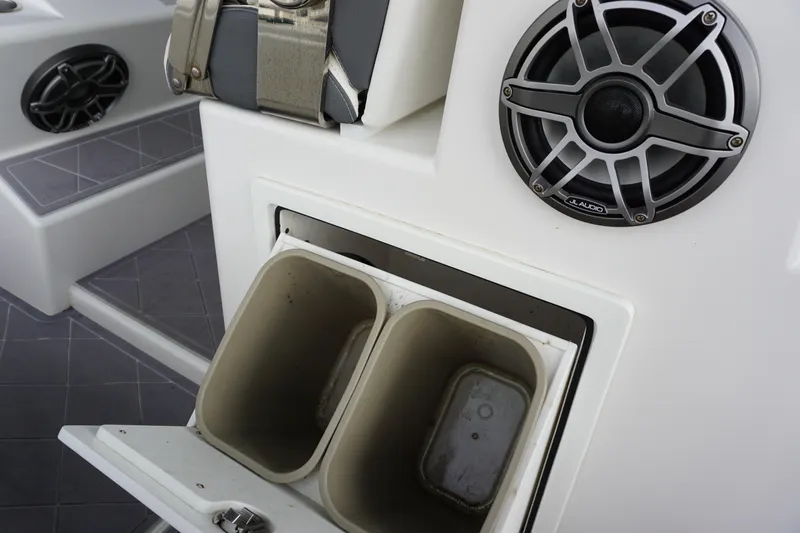 Obsession II Yacht Photos Pics 2023 Insetta 35IFC boat interior with JL Audio speaker and storage compartments.