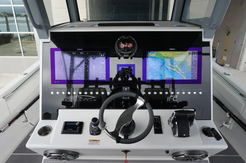 Obsession II Yacht Photos Pics 2023 Insetta 35IFC boat dashboard with advanced navigation and control systems.