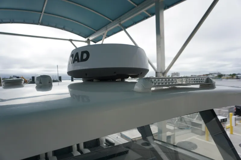 Obsession II Yacht Photos Pics 2023 Insetta 35IFC boat radar and light bar under canopy.