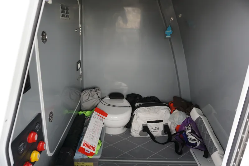 Obsession II Yacht Photos Pics 2023 Insetta 35IFC interior storage area with various bags and equipment.