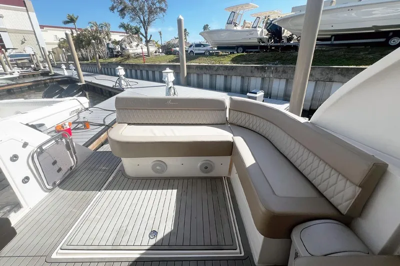  Yacht Photos Pics Luxurious seating on a 2024 Hanover 375 boat docked at a marina.